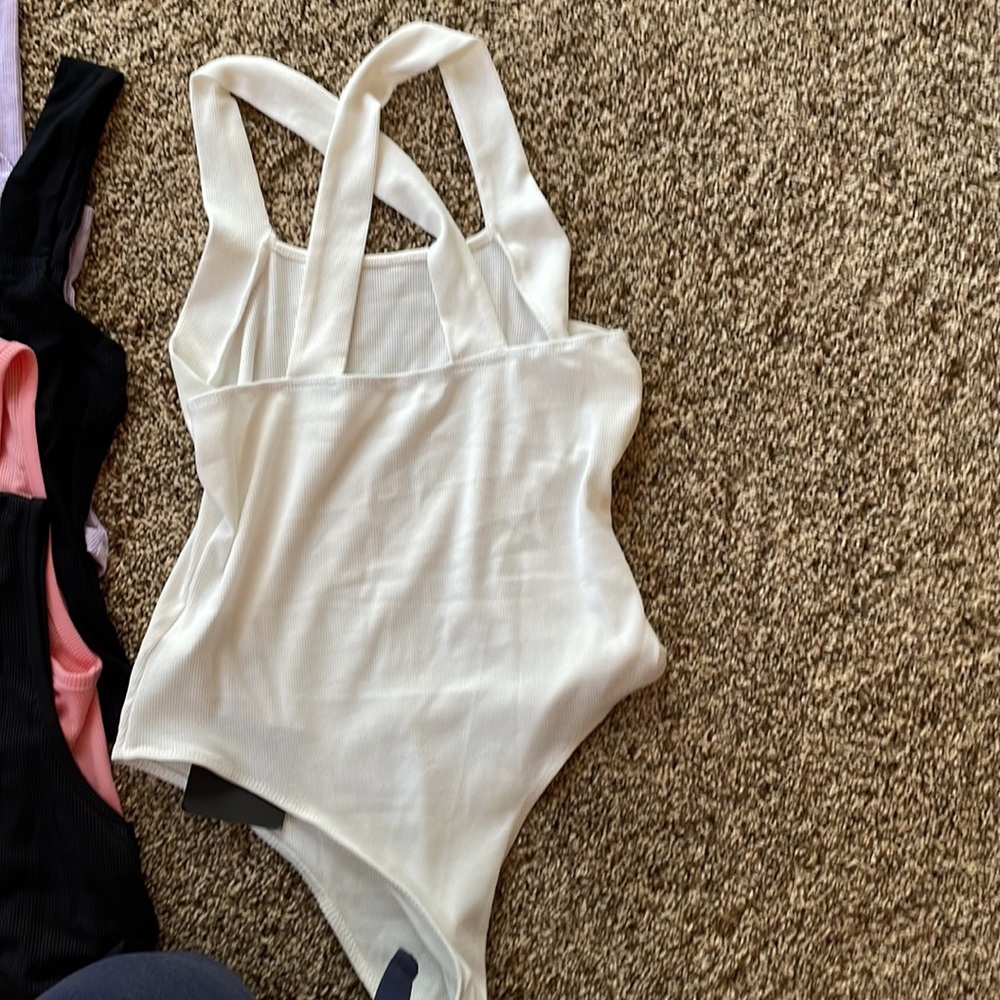 NEW size large but runs more like medium, and a body suit size small. Lot of 4 - Picture 5 of 9